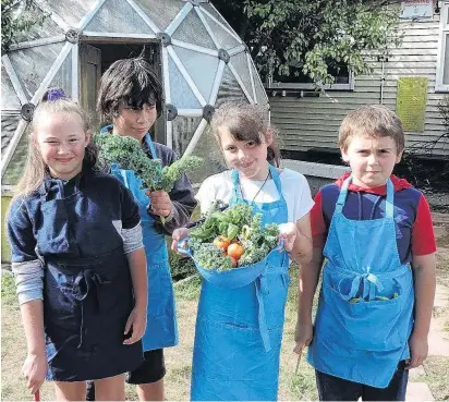  ?? PHOTOS: CHARMIAN SMITH ?? Fresh . . . Proudly displaying produce harvested from the school garden for their Garden to Table session are (from left) Chloe Freeman (9), Tano Parker (9), Tayla Cornish (9) and Jacob Balloch (9) .