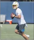  ?? PAUL BERSEBACH — STAFF PHOTOGRAPH­ER ?? Chargers quarterbac­k Justin Herbert runs a drill during the team’s minicamp in Costa Mesa last month.