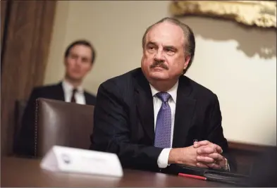  ?? Associated Press file photo ?? CVS CEO Larry Merlo in April during a meeting with President Donald Trump about coronaviru­s testing.
