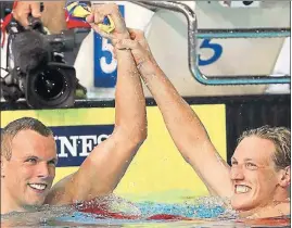  ?? AP ?? ■ Aussie Kyle Chalmers (left) celebrates his 200m freestyle win with teammate Mack Horton.