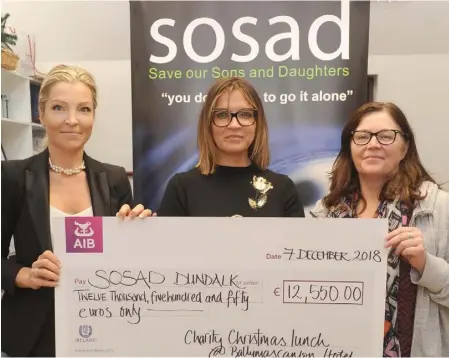  ??  ?? Johanna Quinn and Hermione Duffy present a cheque for €12,550 to Ciara Solan in the SOSAD Office, Dundalk. Photo by Aidan Dullaghan/Newspics.