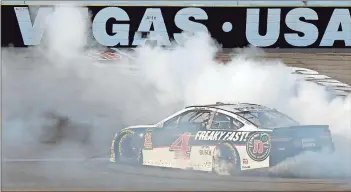  ?? Isaac Brekken / AP ?? Kevin Harvick performs a burnout after winning Sunday’s NASCAR Cup series race at Las Vegas Motor Speedway.