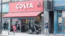 ?? NISHAT AHMED THE ASSOCIATED PRESS ?? Coca-Cola said Friday it will buy the Britain's biggest coffee company, Costa, from Whitbread for US$5.1 billion in cash.