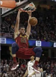  ?? TONY DEJAK — THE ASSOCIATED PRESS ?? The Cavaliers’ Larry Nance Jr. dunks against the Nets during the second half of the Cavaliers’ 129-123 win at Quicken Loans Arena.