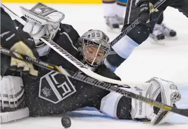  ??  ?? Los Angeles Kings goalie Jonathan Quick makes a save against the San Jose Sharks during the third period in Game 7 of the Western Conference semifinals in the NHL hockey Stanley Cup playoffs Tuesday in Los Angeles. (AP)