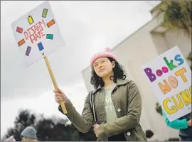  ?? Jay L. Clendenin Los Angeles Times ?? A REPORT found that other California counties have stricter gun controls than L.A. County. Above, Georgia Davis-Bonk, 13, at a No Guns rally in Studio City.