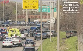  ?? TYLER LARIVIERE/SUN-TIMES ?? Police at the scene of the I-290 shooting Thursday near Westcheste­r Boulevard.