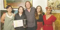  ??  ?? Lee Paje (second from left) of Tin-Aw Art Gallery receives the Grand Prize of the 3rd Annual Don Papa Art Competitio­n for her work “Passage to The Land of Sugar.” She is flocked by Don Papa Rum executives ( Monica Llamas- Garcia, Stephen Carroll, Erica...