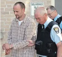  ?? PEG MCCARTHY/TORSTAR FILE PHOTO ?? Marc Vickers of Warkworth is led from court during his 2009 trial over the death of Michelle Barnoski.