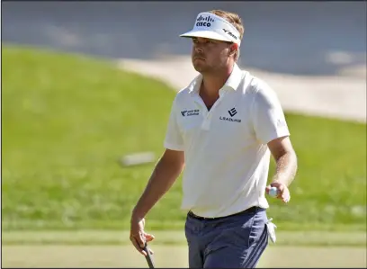  ?? CHRIS O’MEARA — THE ASSOCIATED PRESS ?? Keith Mitchell reacts to his birdie putt on the 14th hole during the third round of the Valspar Championsh­ip golf tournament Saturday at Innisbrook in Palm Harbor, Fla.