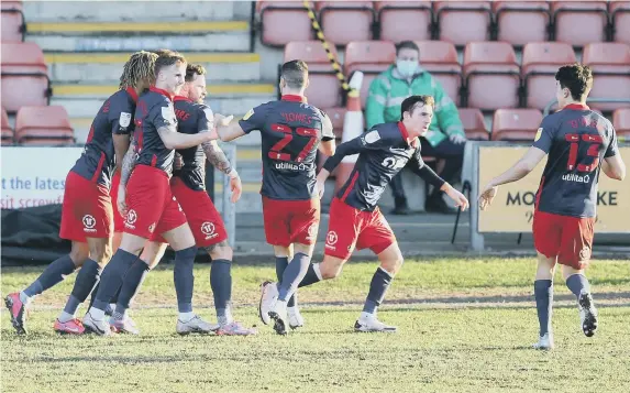  ??  ?? Sunderland players celebrate the late equaliser at Crewe.