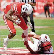  ?? [AP PHOTO] ?? Texas Tech cornerback Desmon Smith, bottom, is trying to drag down its bad defensive reputation.