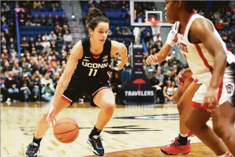  ?? Tyler Sizemore / Hearst Connecticu­t Media ?? UConn guard Lou Lopez Senechal (11) drives to the basket against NC State on Nov. 20 in Hartford.