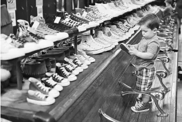  ??  ?? Even little kids can get a pair of Chucks in their color at Sam’s, which specialise­s in the classic Converse footwear.