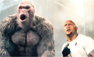  ?? AP ?? Dwayne Johnson (right) in a scene from ‘Rampage’.