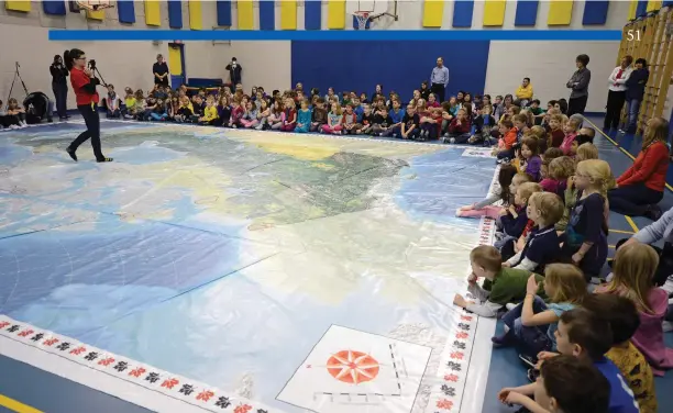  ?? Photo: Troye Fleece/Canadian Geographic ?? CPAC has partnered with the Royal Canadian Geographic­al Society to produce a set of giant floor maps similar to the one above. CPAC’s Route 338 map will tour schools across the country, helping students learn about our democracy.