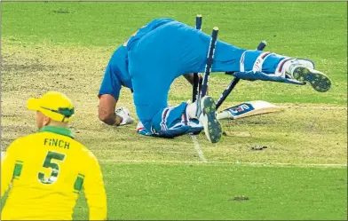  ??  ?? Century boy Rohit Sharma gets stuck in the stumps at the SCG yesterday