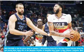  ??  ?? NEW ORLEANS: In this file photo taken on January 7, 2019 Anthony Davis #23 of the New Orleans Pelicans drives the ball around Marc Gasol #33 of the Memphis Grizzlies at Smoothie King Center in New Orleans, Louisiana. Marc Gasol and Markelle Fultz were reported to be on the move on February 7, 2019 as the NBA’s trade deadline expired with no deal for New Orleans Pelicans star Anthony Davis. — AFP