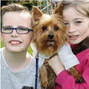  ??  ?? Diesel power Cousins Leon Marshall, 10, and Leanne Shaw, 10, with Yorkie Diesel