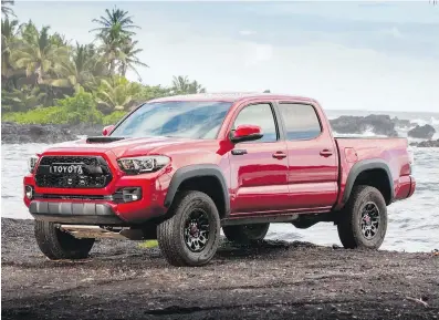  ??  ?? The TRD Pro is recognizab­le by the blacked-out grille and fender cladding, along with the hood scoop.