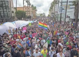  ?? GETTY IMAGES ?? People gather for the start of ResistMarc­h during the 47th annual LA Pride Festival in the Hollywood section of Los Angeles on Sunday.