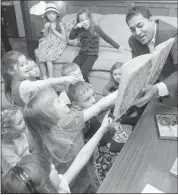  ?? Grant Black, Calgary Herald ?? Alberta Liberal Leader Raj Sherman reads to children during a campaign stop in the riding of Calgary-currie on Friday in support of candidate Norval Horner.