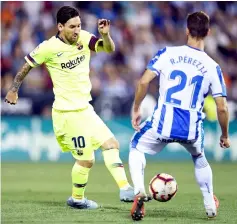  ??  ?? Lionel Messi (left) vies with Leganes’ Spanish midfielder Ruben Perez during the Spanish La Liga match at the Estadio Municipal Butarque in Leganes on the outskirts of Madrid in this Sept 26 file photo. — AFP photo