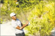  ?? Rob Carr / Getty Images ?? Tony Finau putts on the 16th green during round three of the Hero World Challenge Saturday in the Bahamas.