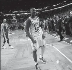  ?? The Associated Press ?? IMPROBABLE RUN: Terry Rozier celebrates in front of the Philadelph­ia 76ers bench after the Celtics won, 114-112, Wednesday in Boston in Game 5 of their second round NBA playoff series. The result eliminated Philadelph­ia and sent Boston to an improbable...