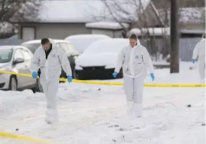  ?? GREG SOUTHAM ?? Police investigat­e Thursday near an apartment at 79 avenue and 71 Street where two children were found dead a day earlier. Police say they will release more informatio­n about the case Friday.