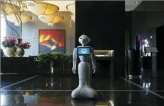  ?? JOHN LOCHER — THE ASSOCIATED PRESS ?? In this photo, a robot named Pepper stands in the lobby of the Mandarin Oriental in Las Vegas.