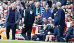  ?? IAN KINGTON/AFP ?? Manchester United’s manager Jose Mourinho (left) and Arsenal’s manager Arsene Wenger (right) on the touchline during their Premier League football match at the Emirates Stadium on May 7.