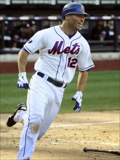  ?? AP Photo ?? Scott Hairston smiles as he scores the winning run on a walk-off single by Ruben Tejada during the ninth inning of the Mets’ win over the Marlins on Sunday.
