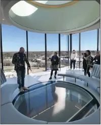  ?? (NWA Democrat-Gazette/Spencer Tirey) ?? Lieven Bertels, director of the Momentary, describes the glass floor set 70 feet above exhibit halls in the new contempora­ry arts space in Bentonvill­e. Video at arkansason­line.com/222opening/.