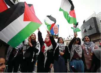  ?? (Pictured: Flags at a February rally in Ramallah in support of PA President Mahmoud Abbas and against Trump’s peace plan; Flash90) ?? ‘IN WHAT universe of twisted logic does it make sense to raise a Palestinia­n flag over the burial site of the Hebrew prophet who uttered them?’