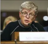  ?? CAROLYN KASTER — THE ASSOCIATED PRESS FILE ?? In this file photo, former Michigan State President Lou Anna Simon testifies before a Senate subcommitt­ee in Washington. Simon has been charged with lying to police conducting an investigat­ion of Larry Nassar’s sexual abuse. Simon, who stepped down earlier this year over the scandal, was charged Tuesday with two felonies and two misdemeano­rs.