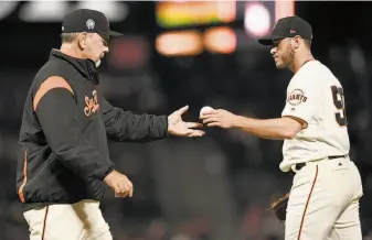  ?? Thearon W. Henderson / Getty Images 2018 ?? A proposal to require relievers to face a minimum of three batters could makes scenes like this, Giants manager Bruce Bochy removing a reliever from a game, less common.