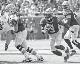  ?? STEVEN CANNON/AP ?? Florida State’s Cam Akers cuts upfield on a running play against Northern Illinois’ defense in the first quarter of Saturday’s game in Tallahasse­e.