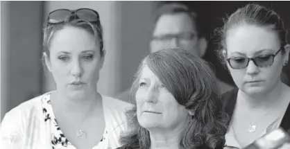  ?? KARL MERTON FERRON/THE BALTIMORE SUN ?? Debra Sorrells, mother of Baltimore County Police Officer Amy Caprio, gazes skyward following the life sentence for her daughter’s death, meted out for 17-year-old Dawnta Harris at Baltimore County Circuit Court on Aug. 21, 2019, in Towson. Harris was tried as an adult earlier this year and convicted of felony murder in the slaying of Caprio.