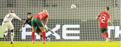  ?? AP ?? Morocco’s Achraf Hakimi (right) fails to score from a penalty kick during an Africa Cup of Nations round of 16 football match against South Africa at the Laurent Pokou stadium in San Pédro, Ivory Coast yesterday.