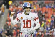  ?? Mark Tenally / Associated Press ?? Giants quarterbac­k Eli Manning celebrates a touchdown against the Redskins on Sunday.
