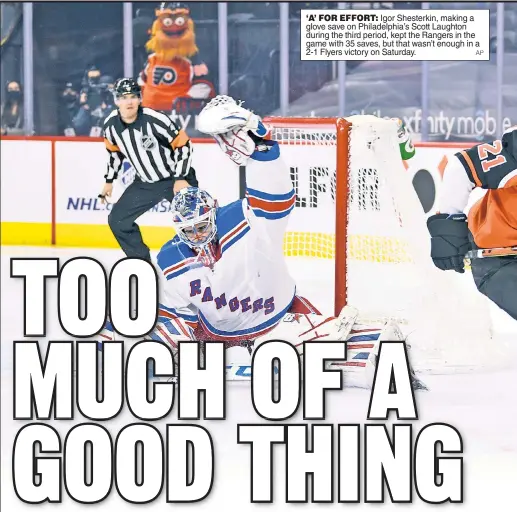  ?? AP ?? ‘A’ FOR EFFORT: Igor Shesterkin, making a glove save on Philadelph­ia’s Scott Laughton during the third period, kept the Rangers in the game with 35 saves, but that wasn’t enough in a 2-1 Flyers victory on Saturday.