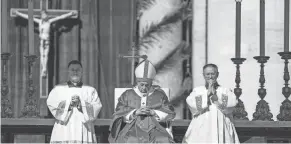  ?? GREGORIO BORGIA/AP ?? Pope Francis celebrates Palm Sunday Mass on Sunday.
