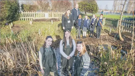  ?? Picture: Habibur Rahman ?? TOP MARKS Trainee teachers from the University of Chichester, Lauren Carter, Rebecca Tuck, Emily Sotheran and Maddie Macey in the Stamshaw Junior School pond, watched by pupils and staff
