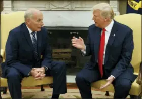  ?? EVAN VUCCI — THE ASSOCIATED PRESS ?? In this July 31, 2017, file photo, President Donald Trump talks with new White House Chief of Staff John Kelly after he was privately sworn in during a ceremony in the Oval Office in Washington. For an administra­tion that has spent 2017 throwing off...