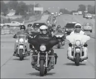  ?? AP/MICHAEL CONROY ?? Indiana Gov. Mike Pence, now the Republican vice presidenti­al candidate, rides Friday in the annual Governor’s Motorcycle Ride in Indianapol­is to benefit the Indiana National Guard Relief Fund.