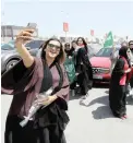  ??  ?? CRUISING: Eman Mohammed, a Bahraini, takes a selfie as she celebrates with Saudi and Bahraini women the lifting of the driving ban on women.