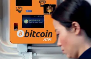  ?? AP ?? A Bitcoin ATM in Hong Kong on Thursday. With the cryptocurr­ency seeing its price soar at about 1,600 per cent, many people used Google to figure out when would be a good time to buy. —