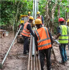  ??  ?? A mineral exploratio­n drilling team drills holes to identify the location and the quality of gold deposits at the Segilola Gold Project site in the village of Iperindo-Odo Ijesha, near the city of Ilesha, Osun State, Nigeria. — AFP photo