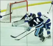  ?? PAUL DICICCO - FOR THE NEWS-HERALD ?? Ice Breakers defenseman Thomas McKinnon shoots Nov. 10 against visiting Watertown at Mentor Civic Arena.